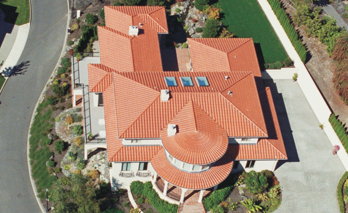 180 degree turret and 180 degree eyebrow turret clay roof tiles in F40 natural red terra cotta on custom home