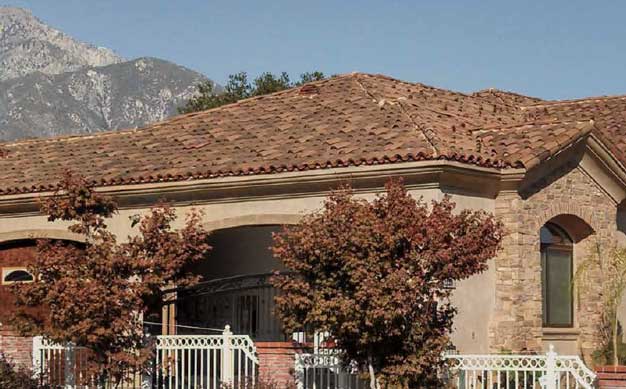 Classic tapered mission clay roof tile in B320-R Rustic Red Blend with 11% boosting in CB364-R Vintage Carmel Blend on home in Upland, CA.