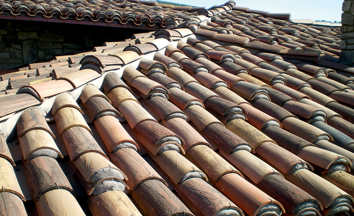 Classic tapered mission clay roof tile in 30% tierra brown, 15% cafe mocca, 15% Vintage Carmel, 15% Cinnamon sandcastle with Maganese, 15% Vintage Red Dark and 10% Tuscan Gold with Sand Cast