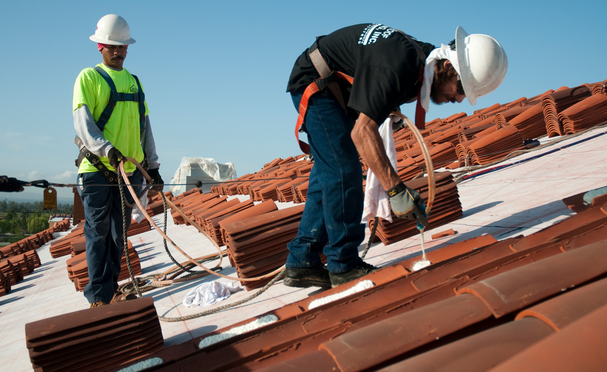 installers working with clay roof tile and Polyset AH-160 application on Orchard Hills K-8 School, Irvine, CA