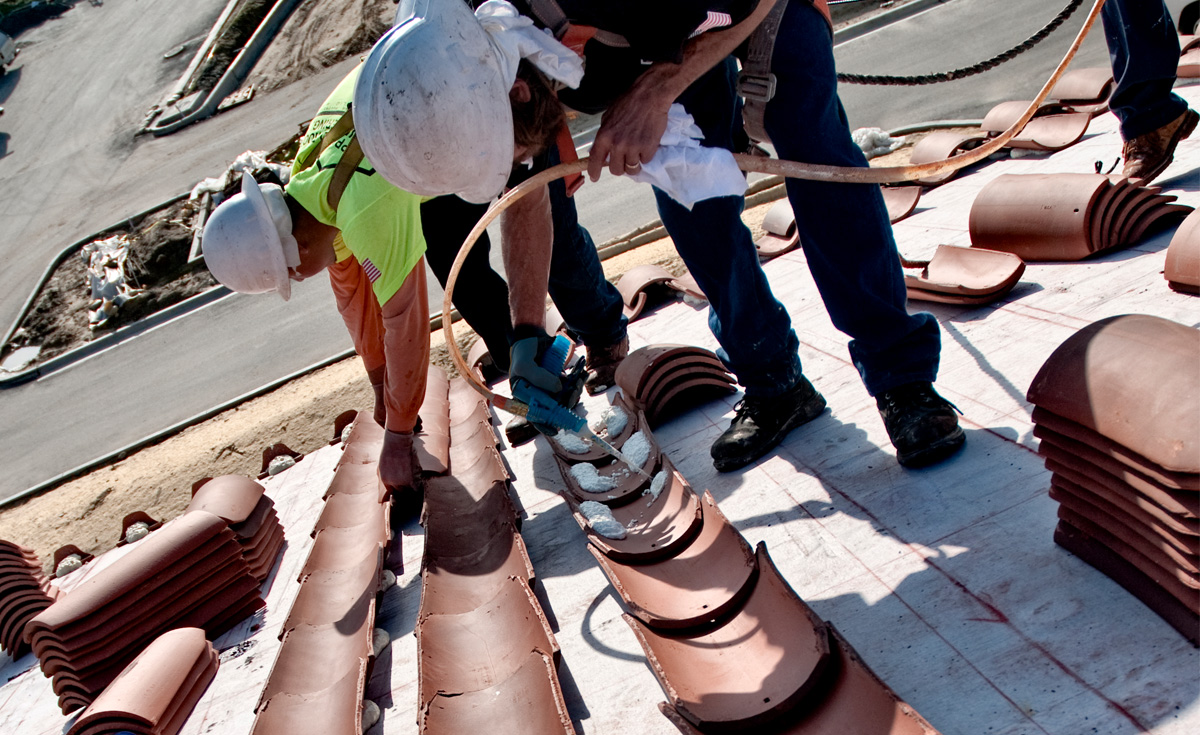 installers working with clay roof tile and Polyset AH-160 application on Orchard Hills K-8 School, Irvine, CA