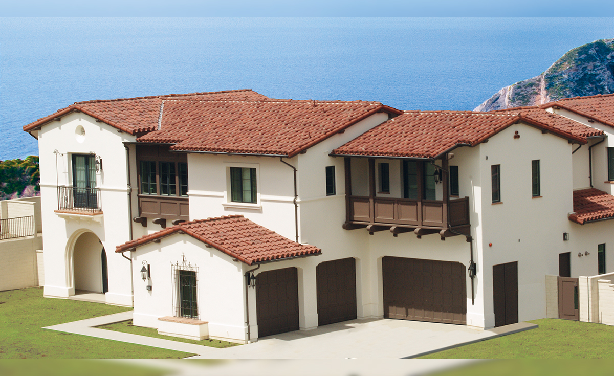 Classic Tapered Mission clay roof tile in 30% Custom Mahogany and 70% Custom Burnt Sienna with requa eave application