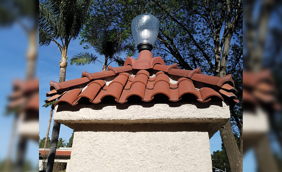 Detail of Wood Street Monuments historical clay roof tile in Riverside, CA - Accurate replica tile and four forked ridge created to match.