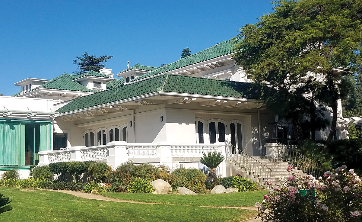 Wrigley Mansion: Tournament of Roses House historical green clay roof tile view from garden in Pasadena, CA