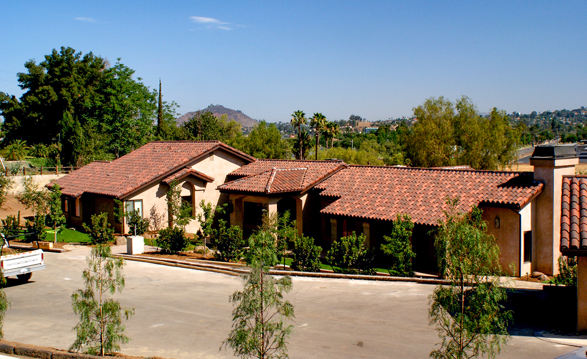 Classic S mission clay roof tile with 2 piece eave line in 1/3 B330-R Old Santa Barbara Blend, 1/3 2F45-SC Tobacco Sand Cast, and 1/3 2F45CC16D Tierra Brown Dark (Smooth) on custom home in El Cajon, California