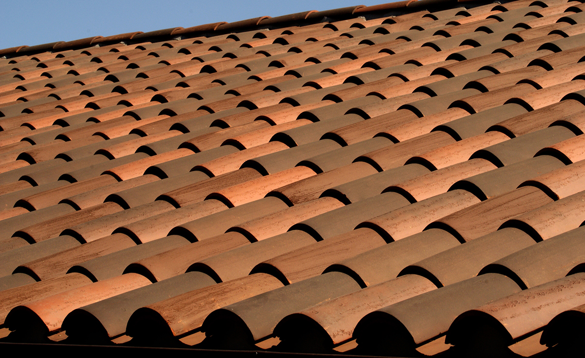 Classic S mission clay roof tile with 2 piece eave line in 1/3 B330-R Old Santa Barbara Blend, 1/3 2F45-SC Tobacco Sand Cast, and 1/3 2F45CC16D Tierra Brown Dark (Smooth) on custom home in El Cajon, California