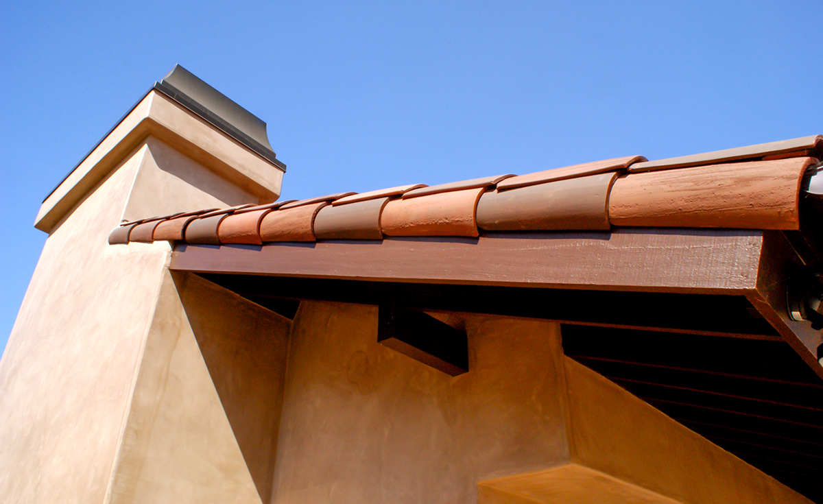 Gable detail of Classic S mission clay roof tile with 2 piece eave line in 1/3 B330-R Old Santa Barbara Blend, 1/3 2F45-SC Tobacco Sand Cast, and 1/3 2F45CC16D Tierra Brown Dark (Smooth) on custom home in El Cajon, California