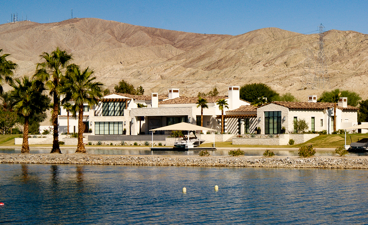 Classic S mission clay roof tile in 50% B317-R Taupe Smoke Blend and 50% B334-R Rustic Ivory Blend with two piece eave application on lakeside home in Indio, California