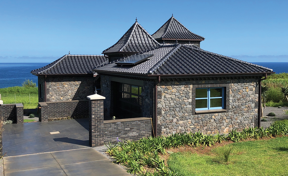 French Chateau inspired home with Improved S clay roof tile with genoise eave in C23 Metallic Silver Clay Roof Tile in Maui, HI