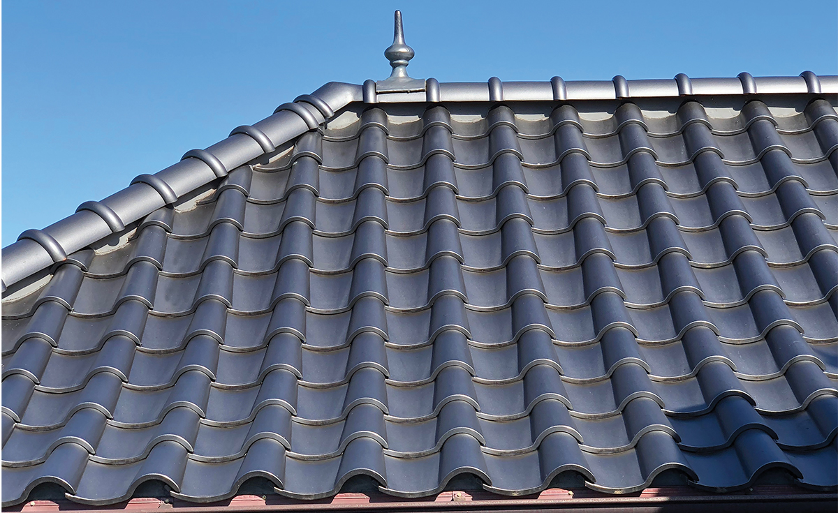 Detail of French Chateau inspired home with Improved S clay roof tile with genoise eave in C23 Metallic Silver Clay Roof Tile in Maui, HI