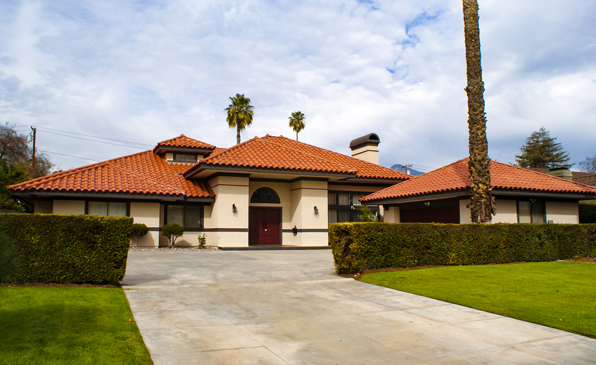 Landscape view of single story home with Corona Tapered mission two piece clay roof tile in F40 Natural Red located in San Marino, CA.