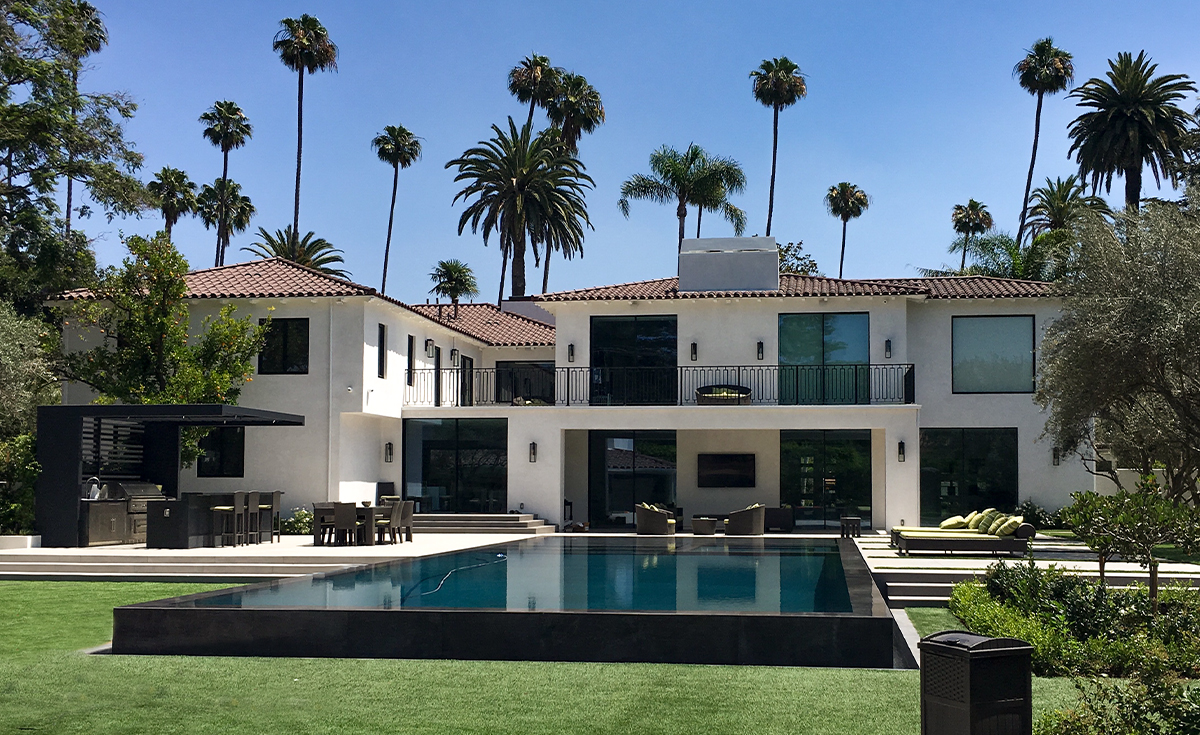 backyard view of home in Beverly Hills with Classic Tapered Mission 2 piece clay roof tile in 2F73 Espresso Brown color.