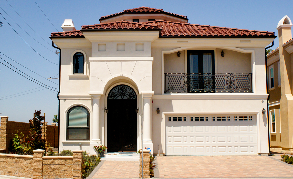 One Piece S Mission clay roof tile in B220 Madrid Blend on Mediterranean style two story custom home in Garden Grove California.