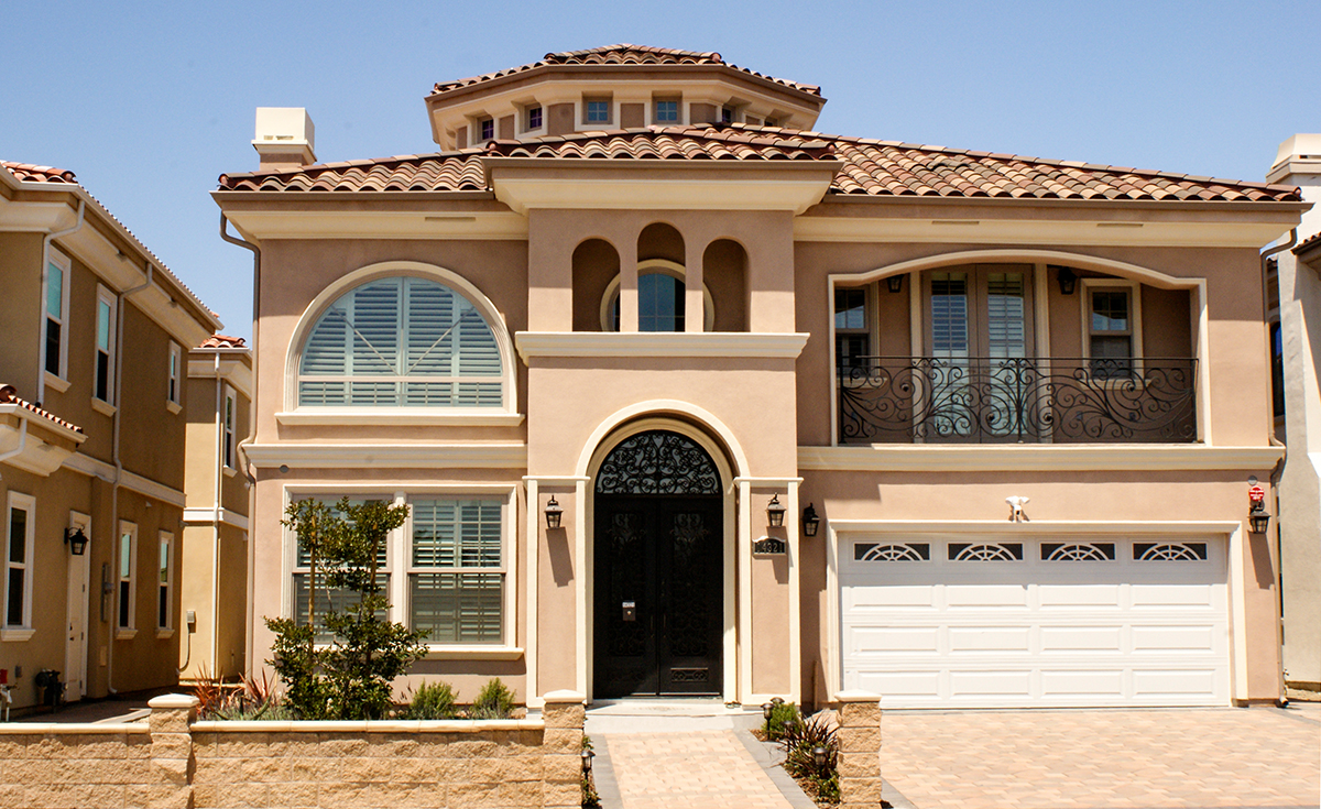 One Piece S Mission clay roof tile in B350 Old Barcelona Blend color on Mediterranean style two story custom home in Garden Grove California.