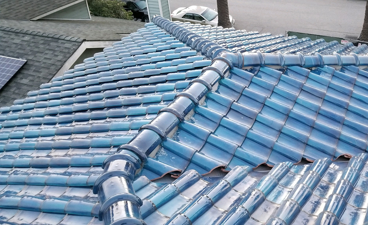 Ridge detail of Improved S terra-cotta clay roof tile glazed in C01 Blue on Culver City home, California