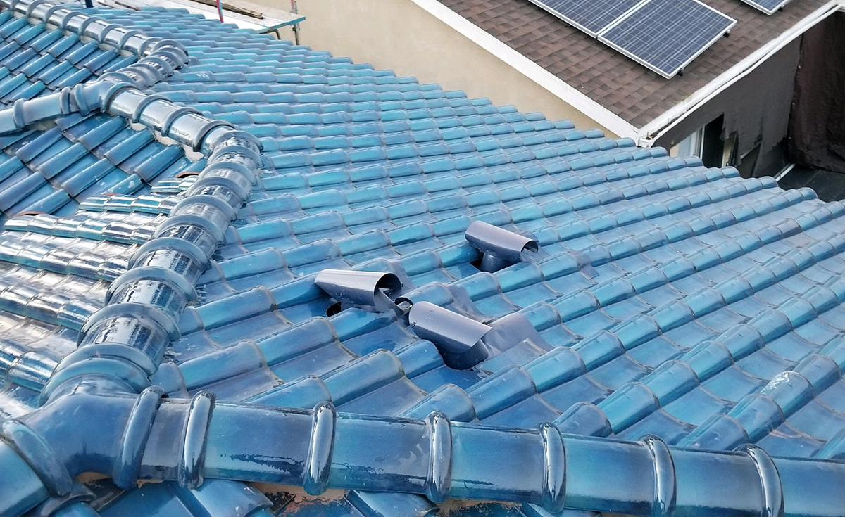 Hip detail of Improved S terra-cotta clay roof tile glazed in C01 Blue on Culver City home, California